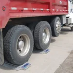 red-dump-truck-weighing-wheels